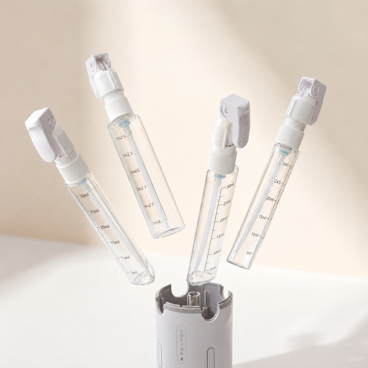 Four refillable bottles lifting out of one base